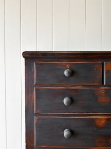 An Ebonized Antique English Chest of Drawers/Dresser