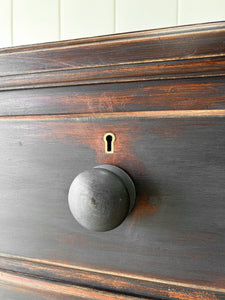 An Ebonized Antique English Chest of Drawers/Dresser