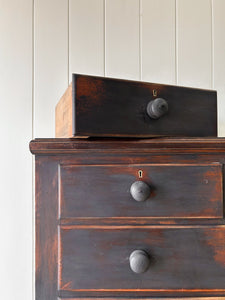 An Ebonized Antique English Chest of Drawers/Dresser