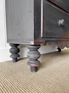 An Ebonized Antique English Chest of Drawers/Dresser