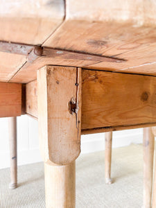 An Antique Pine Oval Drop Leaf Kitchen Dining Table with Spoon Feet