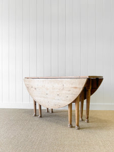 An Antique Pine Oval Drop Leaf Kitchen Dining Table with Spoon Feet