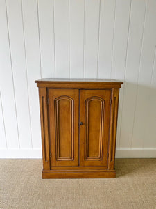 A Handsome English 19th Century Faux Painted Pine Cupboard