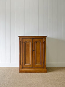 A Handsome English 19th Century Faux Painted Pine Cupboard