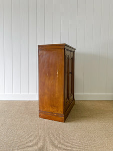 A Handsome English 19th Century Faux Painted Pine Cupboard