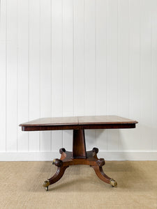 An English Mahogany Breakdast Table with Castors