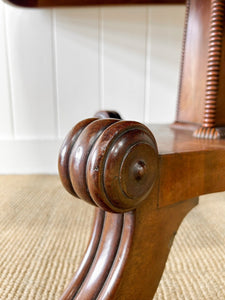 An English Mahogany Breakdast Table with Castors