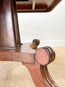 An English Mahogany Breakdast Table with Castors