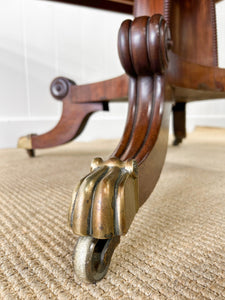 An English Mahogany Breakdast Table with Castors