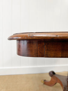 An English Mahogany Breakdast Table with Castors